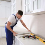 Kitchen Remodeling Installer Performing Installation