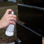 Man Performing Cabinet Refinishing