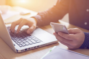 Person On Laptop Filling In Information