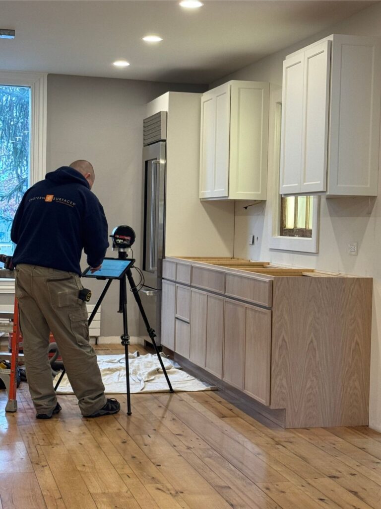 Installer doing countertop templating and measurement
