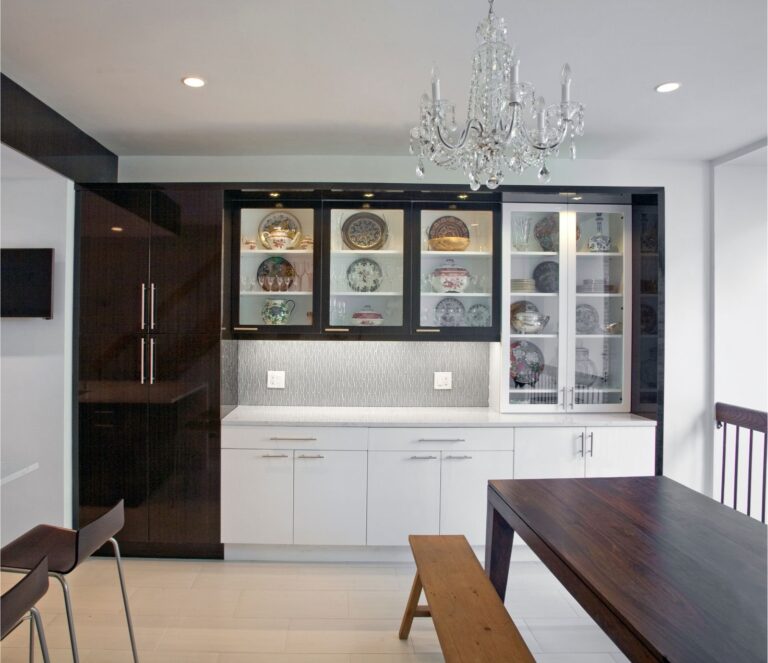 Custom cabinets with glass display doors and built-in storage