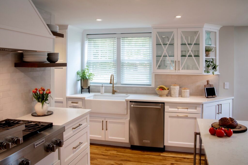 Custom white kitchen cabinets with glass display doors