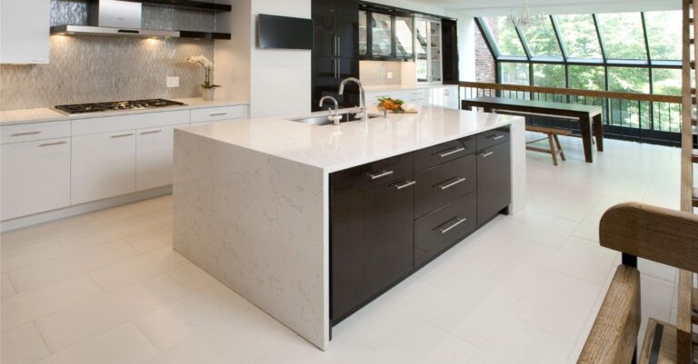Modern two-tone kitchen island with waterfall countertop