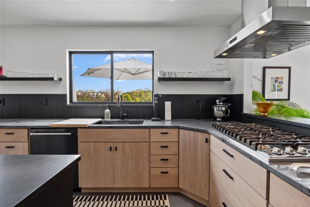 White oak cabinet refacing with dark quartzite countertops in Doylestown, PA