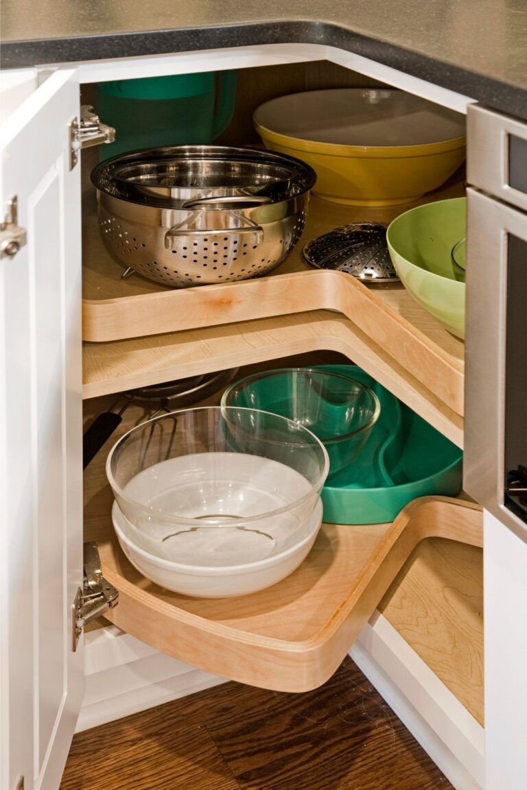 Open corner base cabinet with lazy Susan organizers for kitchen storage