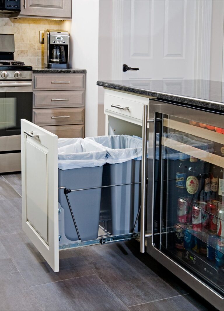 Pull-out double trash cabinet beside beverage refrigerator in Ambler, PA